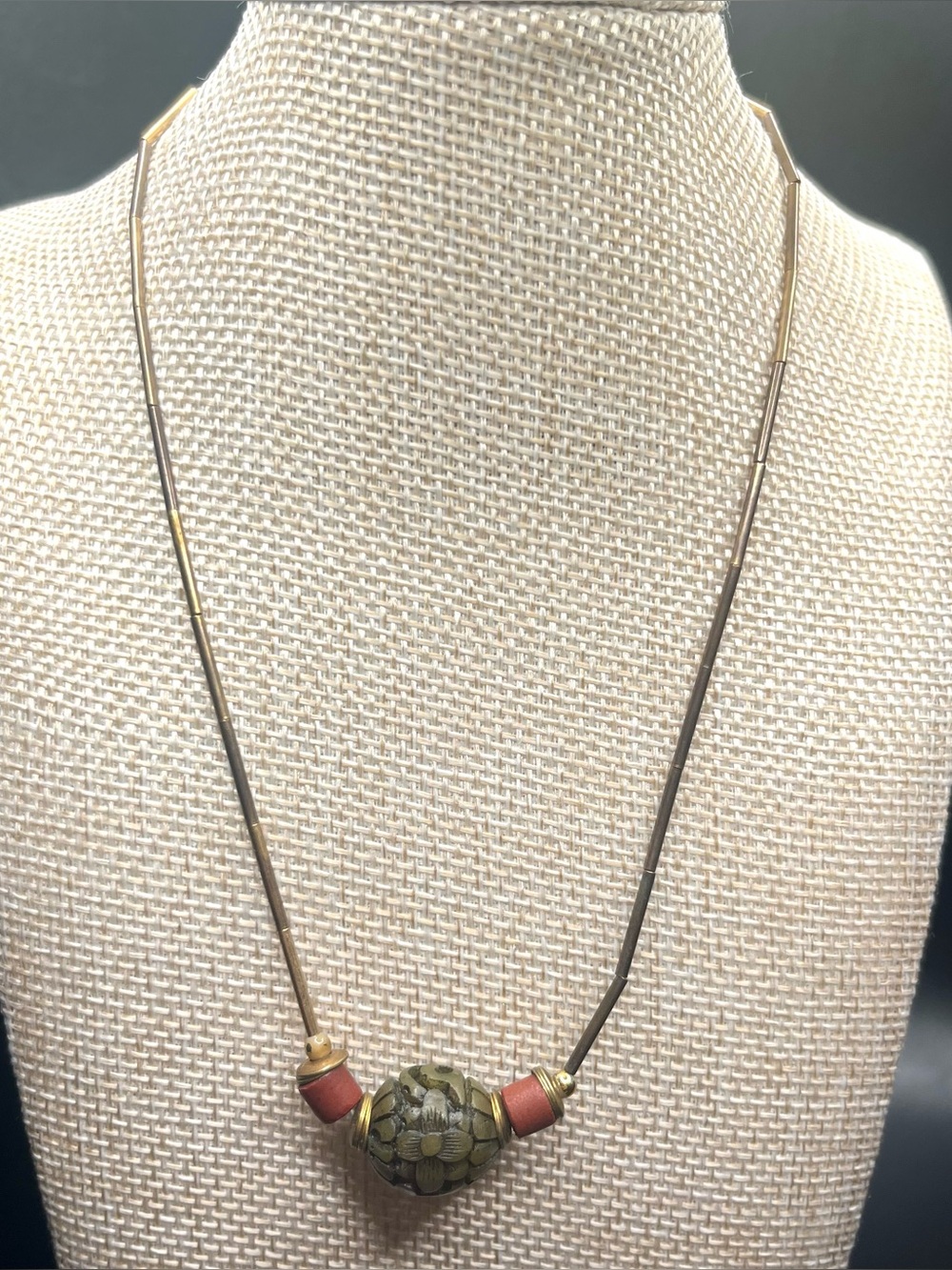 Vintage brass tone tube necklace with carved center bead pendant earthy boho